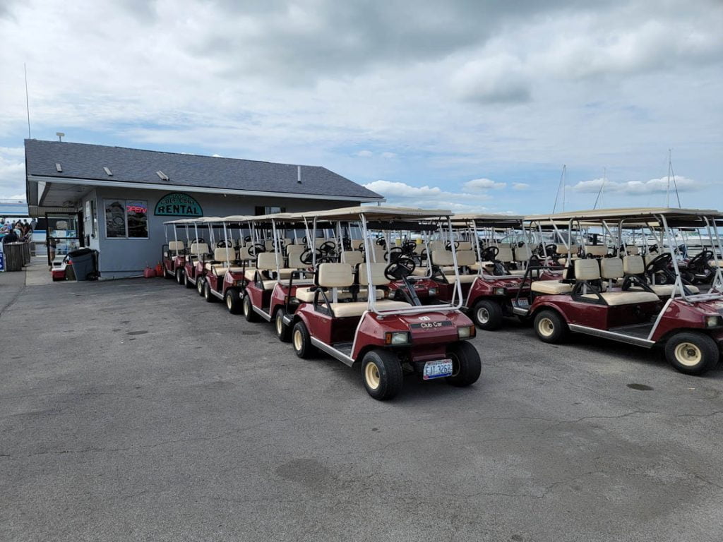 Golf carts waiting for rentals near the docks in Kelleys Island
