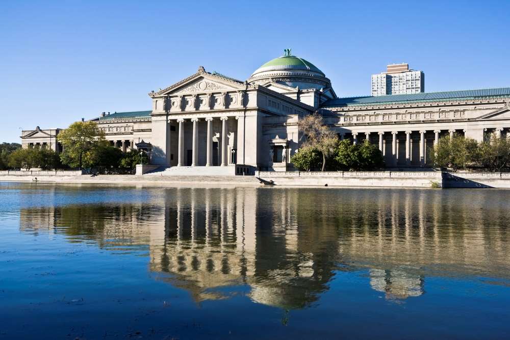 Museum of Science and Industry Chicago, in Jackson Park. Museum reflected in lagoon.