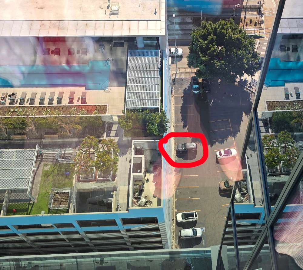 Parking in downtown Los Angeles with car circled in red. View from above.